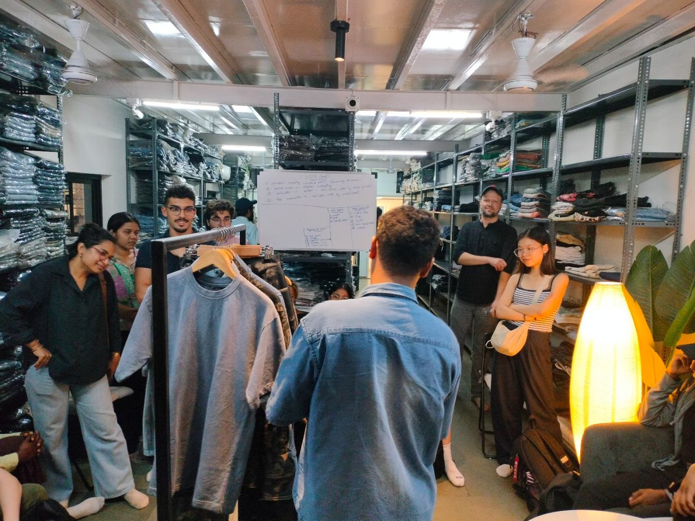 Rohan showcasing his work to the urbz team and the students of NYUAD, at the DFC warehouse during their 2025 visit to Dharavi