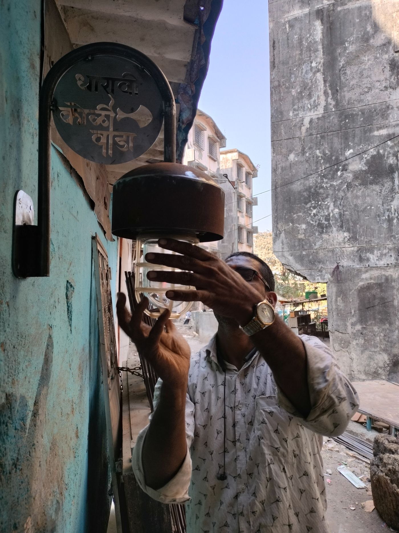 Local fabricator, Dutta Koli, fitting the ship lights into customised brackets