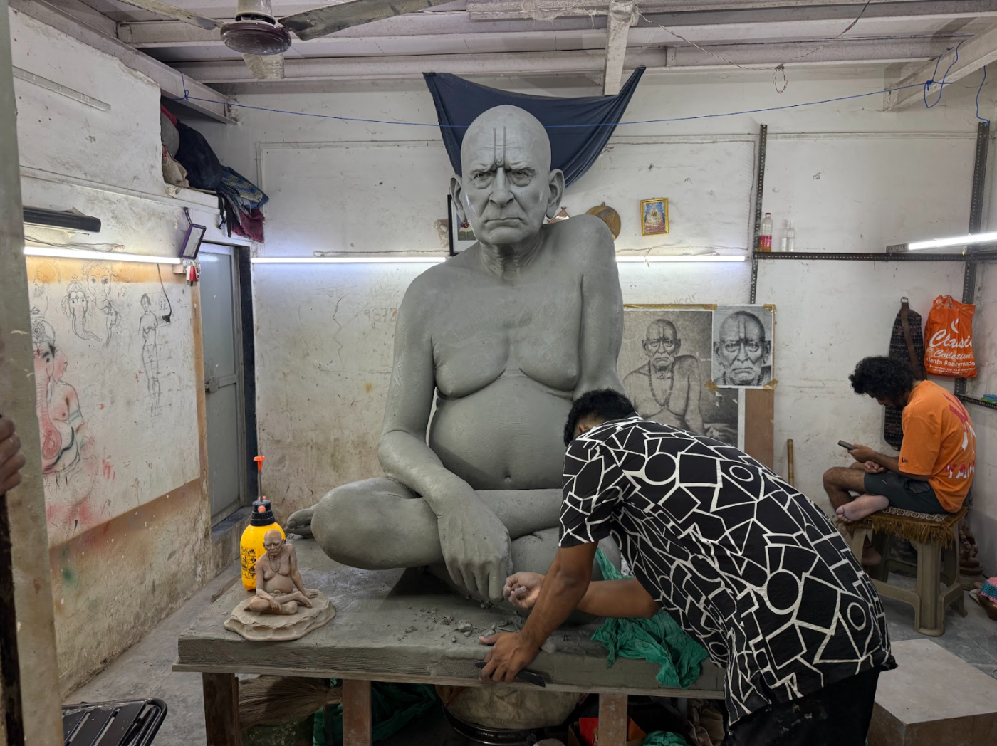 The second studio, with drawings around a large Saibaba sculpture
