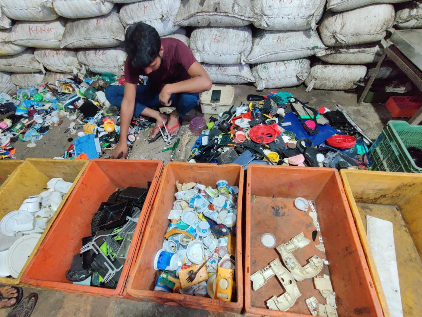 Worker sorting colour and material wise