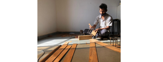 Manoj at the office, preparing the wooden members to be cut and modified according to the steel frame. 