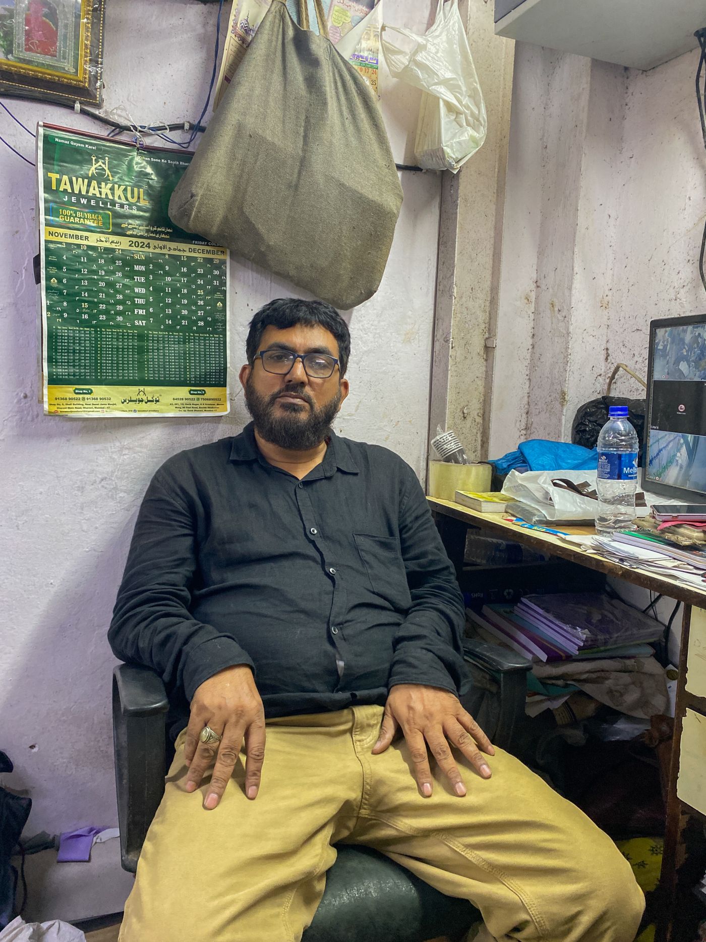Khurshid Bhai, at his work desk