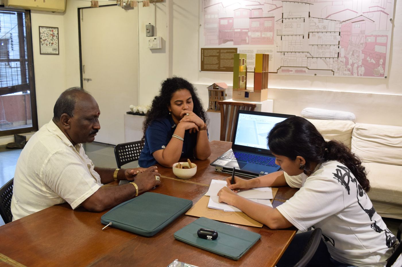 In process discussion of the house Arunlal is designing with the urbz team