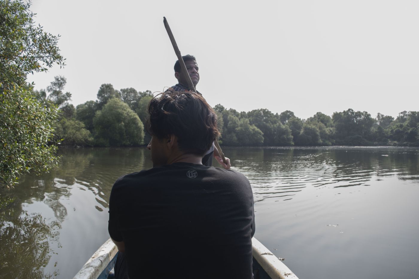 Wilson Koli takes students to his pond