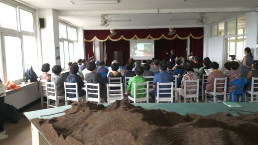 Local villagers attend discussions during the workshop