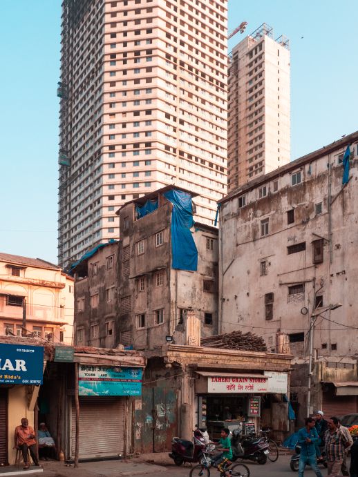 The contrast between new high-rises and older buildings is evident in Mumbai.