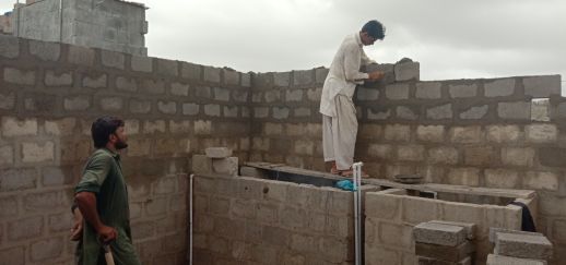 Laying of bricks in the Katchi Abadis of Orangi.