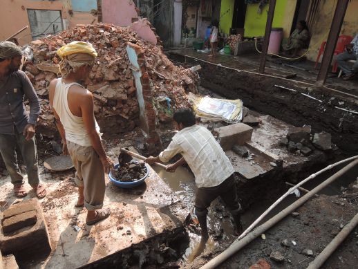 Risen ground water during excavation for foundation at Jairam Seth Chawl in Dharavi Koliwada